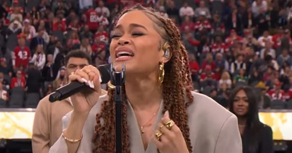 Woman singing black national anthem